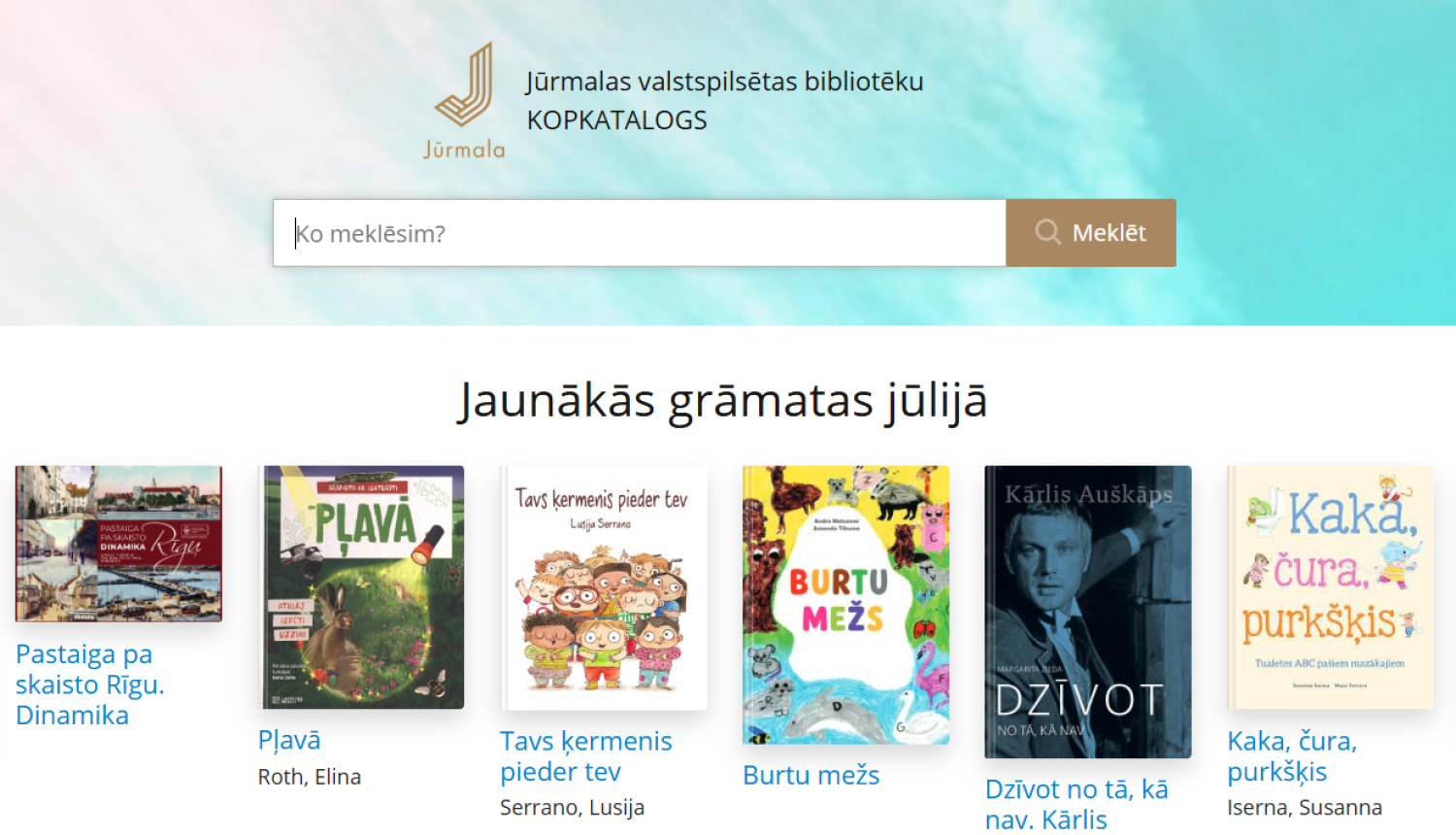 ūrmalas valstspilsētas bibliotēku kopkataloga ekrānuzņēmums. Augšpusē ir meklēšanas josla, bet zem tās sadaļa 'Jaunākās grāmatas jūlijā' ar sešu grāmatu vākiem: 'Pastaiga pa skaisto Rīgu', 'Pļavā', 'Tavs ķermenis pieder tev', 'Burtu mežs', 'Dzīvot no tā, kā nav' un 'Kaka, čura, purkšķis'.